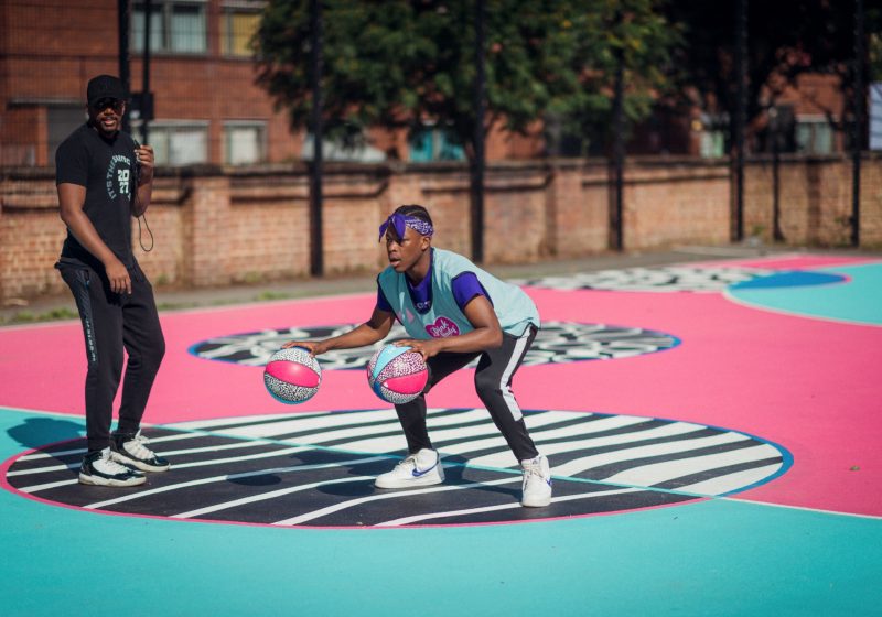 Shooting hoops at the Pink Lady® basketball court